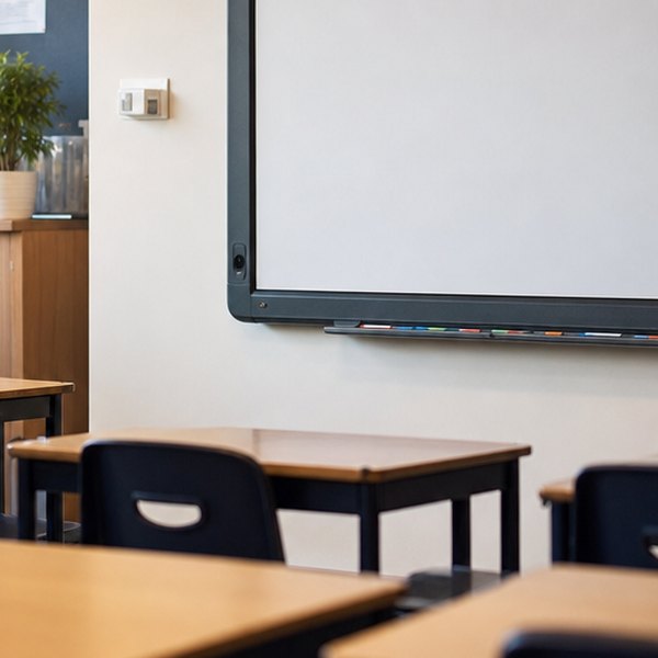 Classroom desk with tax documents and calculator — detail